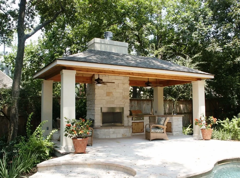 a gazebo with outdoor fireplace by infinite custom patios in houston