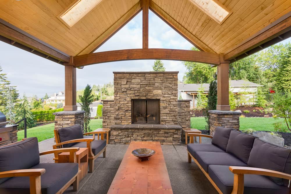 pergola with fireplace and seating in houston