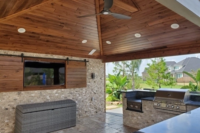 patio cover with outdoor kitchen near houston