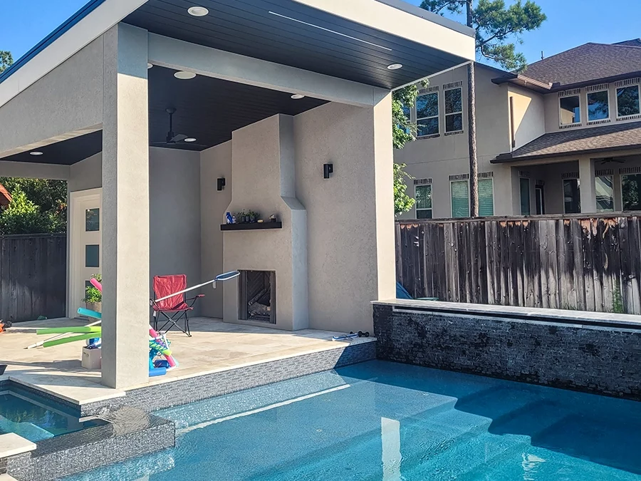 covered patio next to a pool