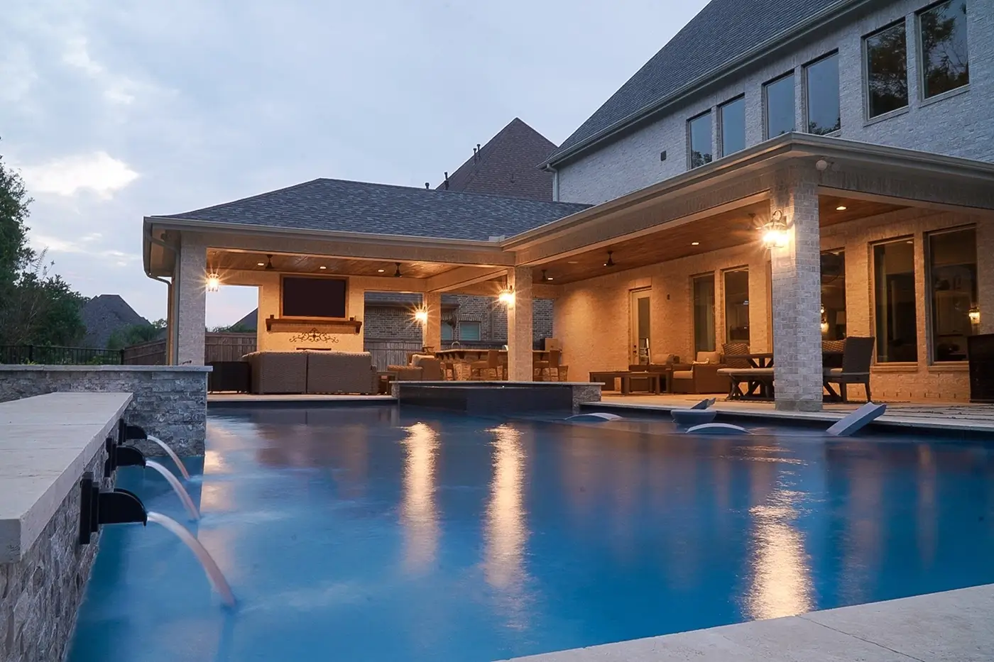 a covered patio and outdoor living area