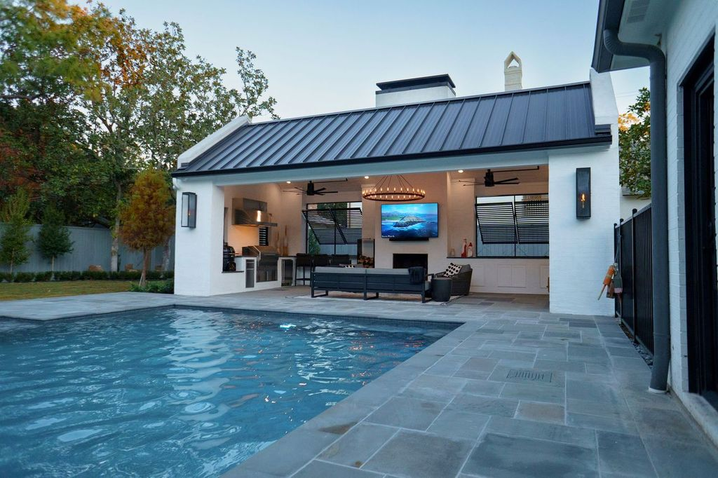 pavers by a pool and pool house