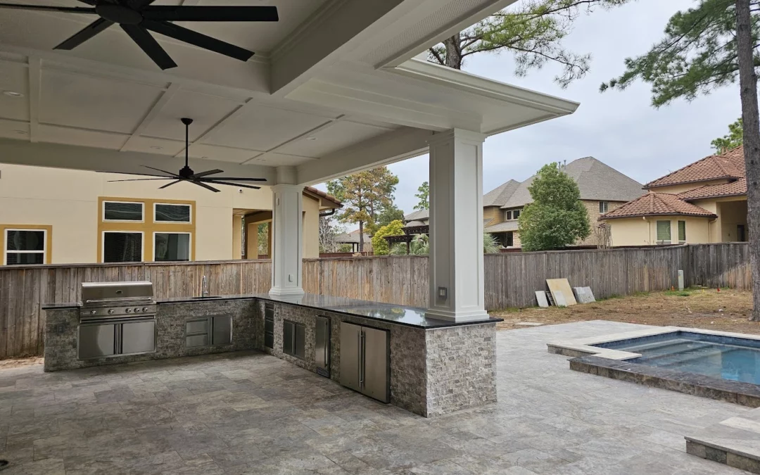 Covered patio, kitchen, and pool